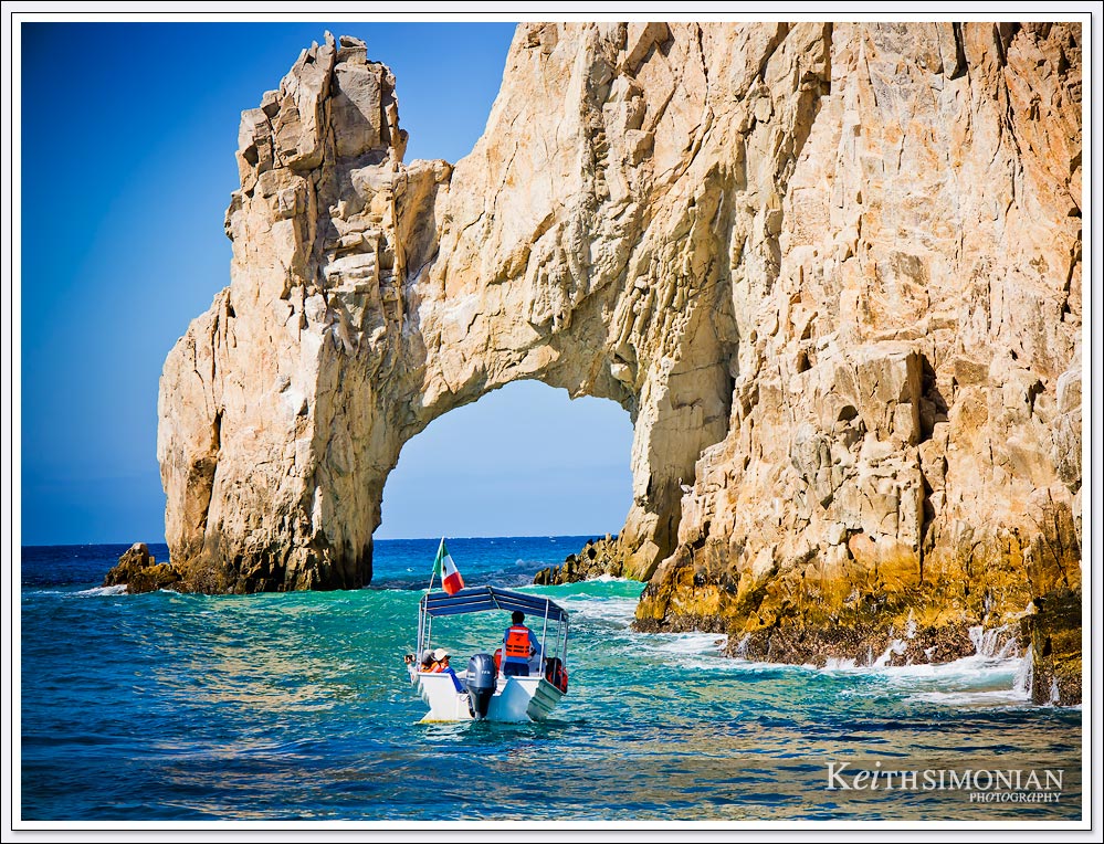 The Arch of Cabo San Lucas with tourist boat sightseeing.